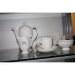 A white Royal Doulton Coffee set with coffee pot, cream jug, sugar bowl and five cups and saucers.