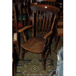 A 19th c. Beech and Elm stickback Elbow Chair with swept arms and shaped elm seat, on turned legs.