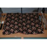 An antique hand quilted Throw/bedspread with pink roses on a black ground