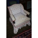 A low Victorian upholstered Nursing Chair in toad and toadstool print fabric,