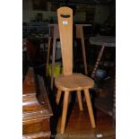 A modern Ash Spinning Chair with single plank back, upper slot handle,