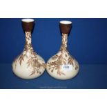 A pair of Wedgwood bulbous shaped Vases having gilt coloured floral pattern,