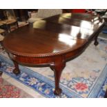 A good Mahogany Oval wind-out extending Dining Table with two extra leaves, carved edges,