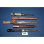 An Antler handled Sheath Knife (no sheath), an ethnic knife and an ebony handled fishing knife.