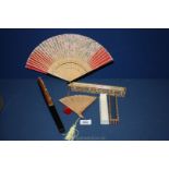 Four oriental folding Fans including one Chinese pierced sandalwood (boxed);