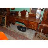 A French Mahogany Sideboard having gallery back with central frieze drawer flanked either side by