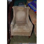 An Edwardian wing back Fireside Armchair with thin wings and back, narrow arms,