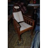 A circa 1900 Oak framed Treatment Chair with adjustable headrest and four position reclining back,