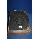 A large leather bound Bible.