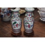 A pair of Cantonese Vases (one damaged),