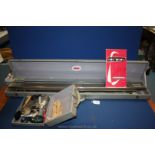 A cased vintage New Long Knitting Machine and case of accessories