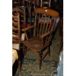 A 19th c. Beech and Elm stickback Elbow Chair with swept arms and shaped elm seat, on turned legs.