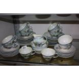 A bone china twelve place setting Teaset having grape design, initialled B.H.A.