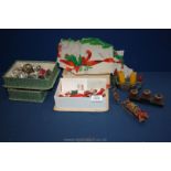 A quantity of antique Christmas cake decorations and Christmas tree candle holders, etc.