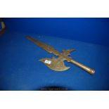 A heavy brass Halberd Head, the grip cast in two sections and well worn, 23" long,