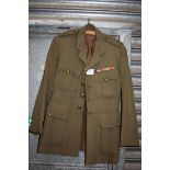 A Royal Artillery khaki Jacket with medal bar possibly belonging to 'M. W.