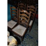 A contemporary set of four Oak ladder back Dining Chairs having five shaped bars to the backs,