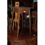 An Edwardian Oak Occasional Table with square top,