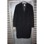 A gent's full length Black Coat 'Savoy Taylor's Group of Wool and Cashmere' in large size