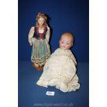 A 1960's coloured Doll and a 1970's Doll in Normandy costume