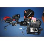 A Polaroid 600 Extreme, Pentax Z-10, Crown Bass Boost System, Olympus Zoom 140 camera,