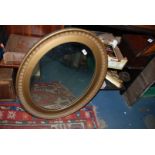 A gilt oval Mirror