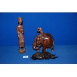 A carved wood depiction of an Indian Elephant with rider, 8'' high,