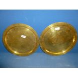 A pair of old heavy Brass Trays with matching borders showing different central designs and Arabic