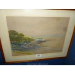 A framed Watercolour of a coastal scene signed lower left Chas. T.