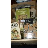 A box of books: hardback and paperback novels etc