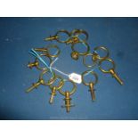 Ten Brass harness loops/guides and odd brass rings.