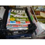 Two crates of Flyer and Country Life magazines