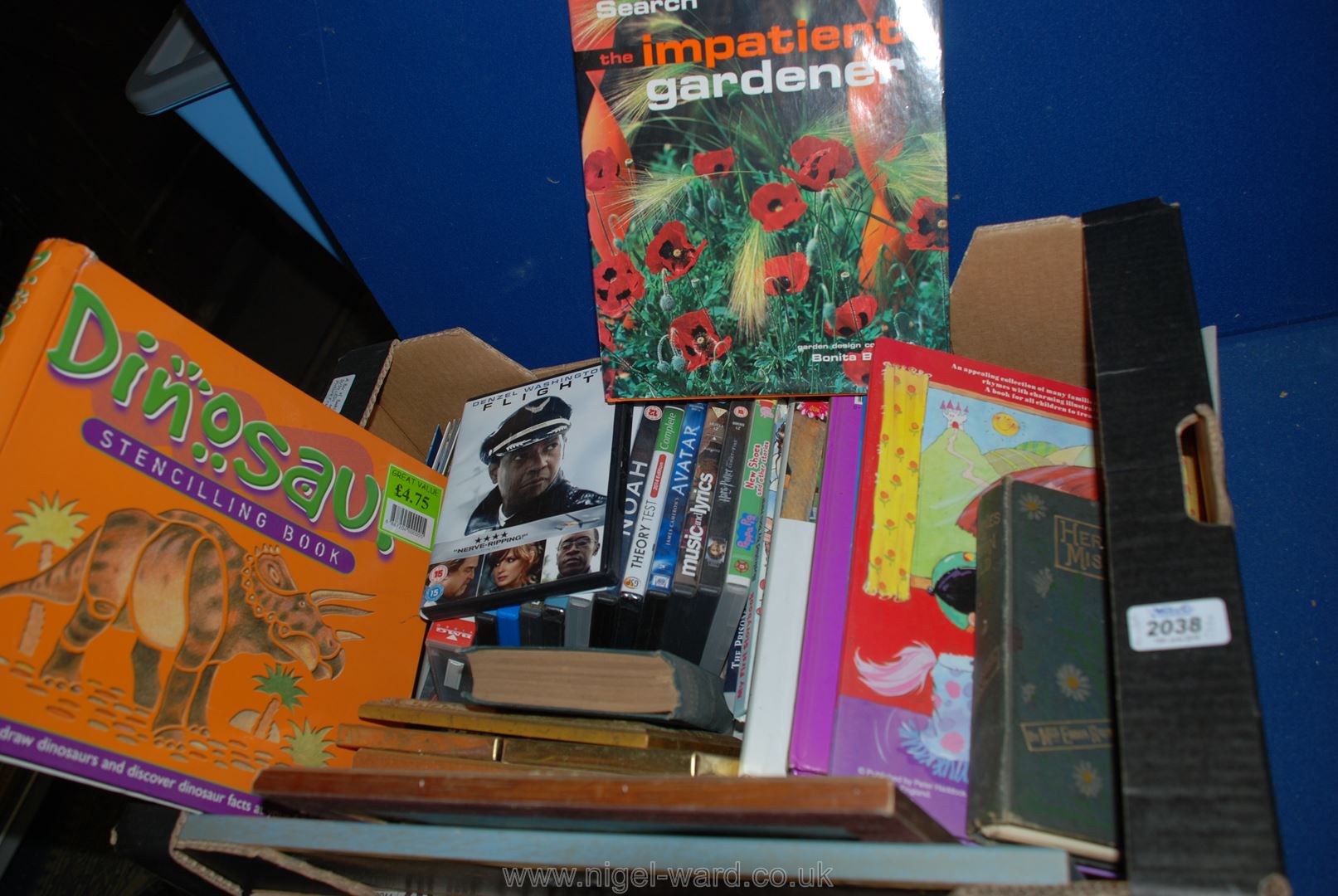 A Box of Books, DVDs, CDs and Picture Frames.