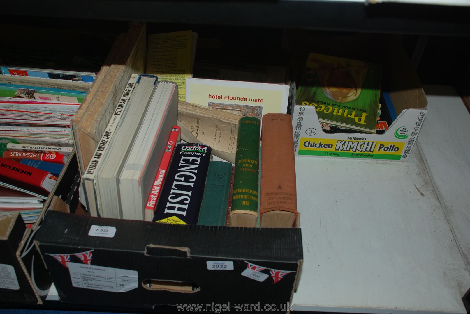 A box of books incl the small holders encyclopedia, first aid,