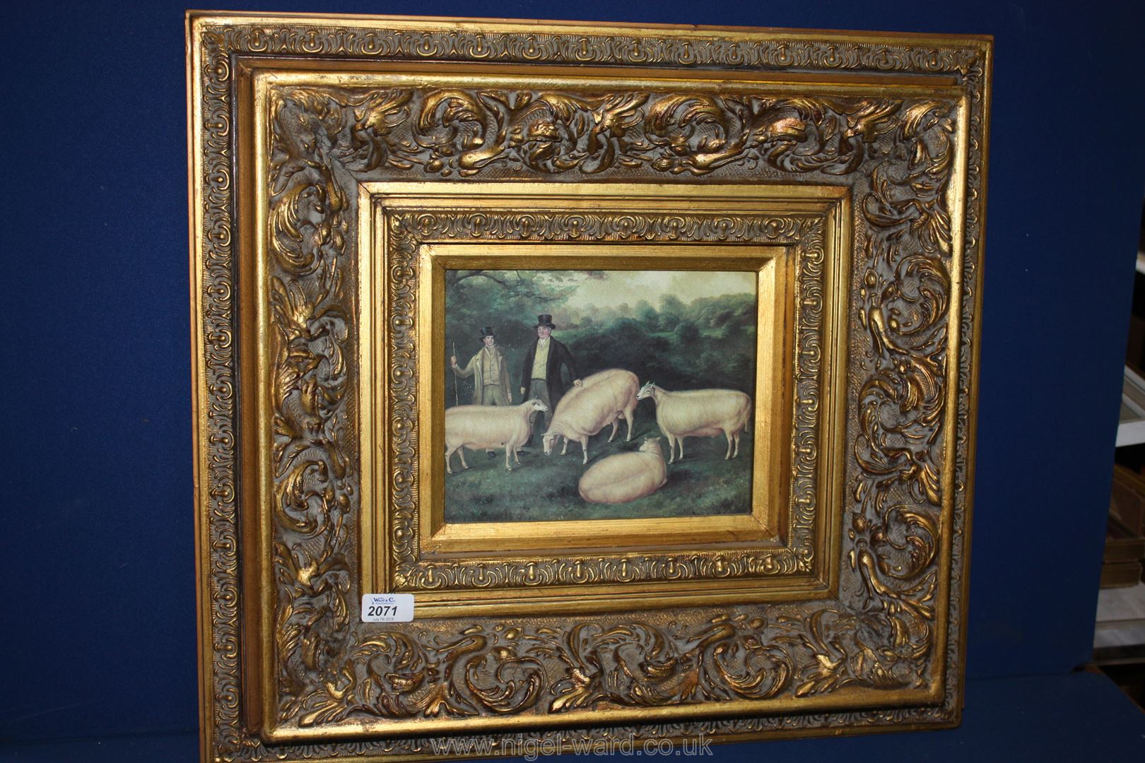 A reproduction framed Print of primitive sheep in a heavy,