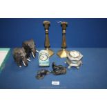 A pair of brass candlesticks with pushers, pair of wooden elephants,