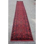 A 100% wool Afghan Khan Runner, red ground with nine gulls,