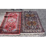 Two hearth Rugs one floral red ground, the other blue ground geometric, (the blue a/f).