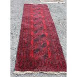 A red ground Runner with eight guls,