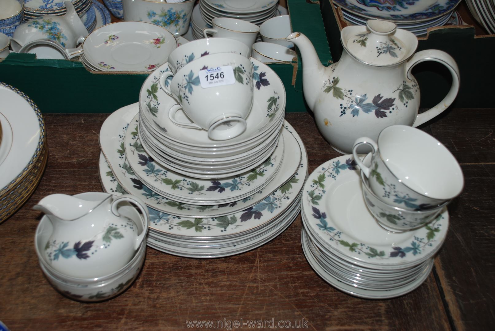 A quantity of Royal Doulton ''Burgundy'' Dinner Service including dinner plates, coffee pot,