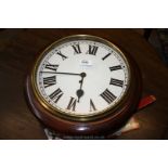 A darkwood cased Wall Clock having simple single train movement, the white face with Roman numerals,