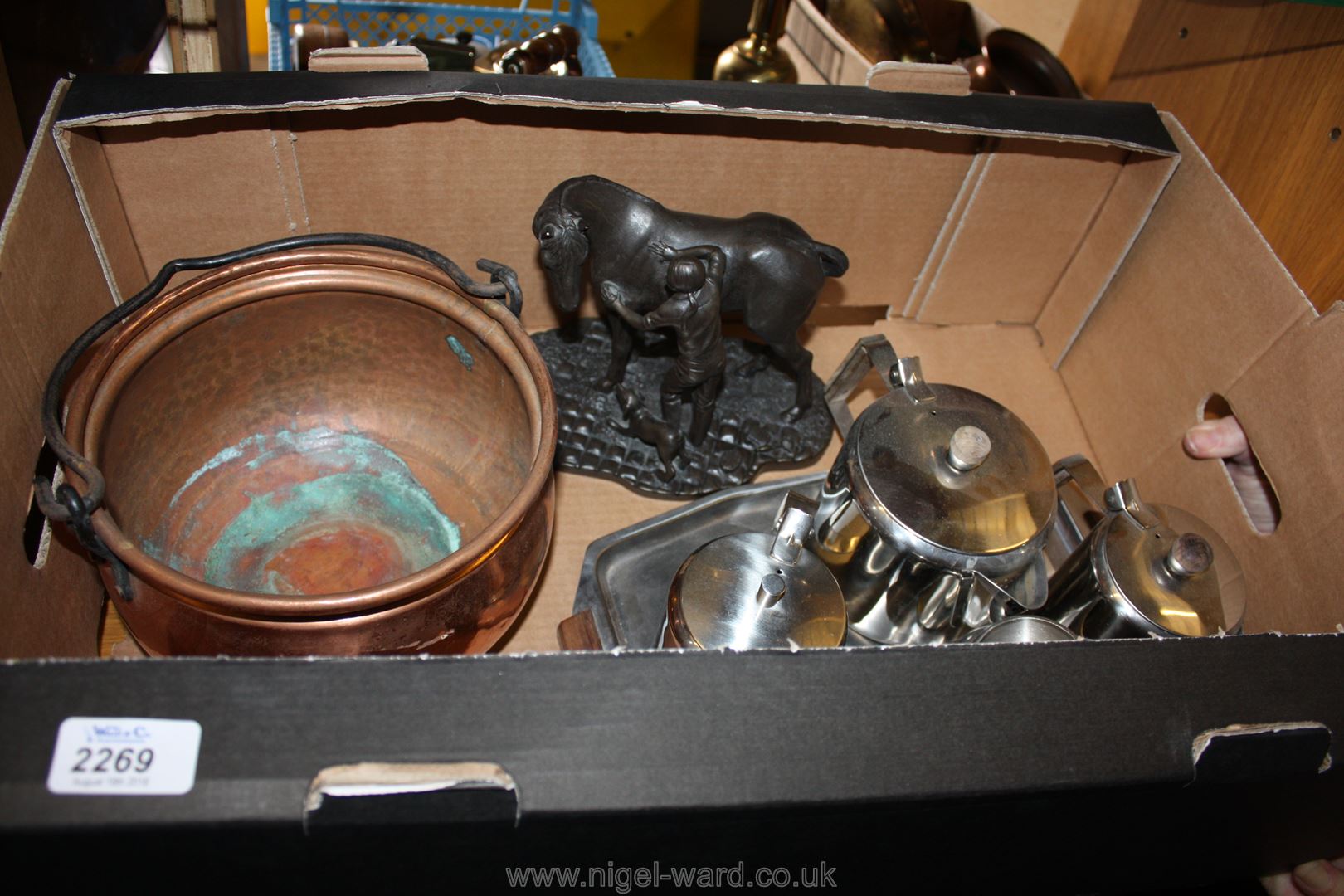 A stainless steel Teaset, copper cauldron and a resin model of a horse and groom.