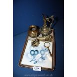 A brass fish door knocker, small brass magnifying glass,