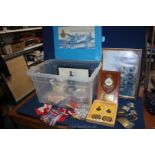 A quantity of encased military badges, RAF plaque, militaria ephemera set of shape flags, etc.