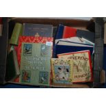 A box of books including The Happy Prince, Mr. Punch, etc.