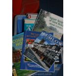 A tub of books including country walks and botanical gardens.