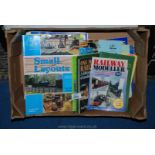 A box of Model Railway information books.