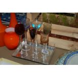 Six tall stemmed and coloured liqueur Glasses