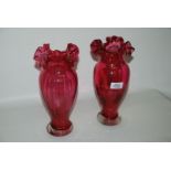 A pair of cranberry glass Vases with ruffled rims, 11" tall.
