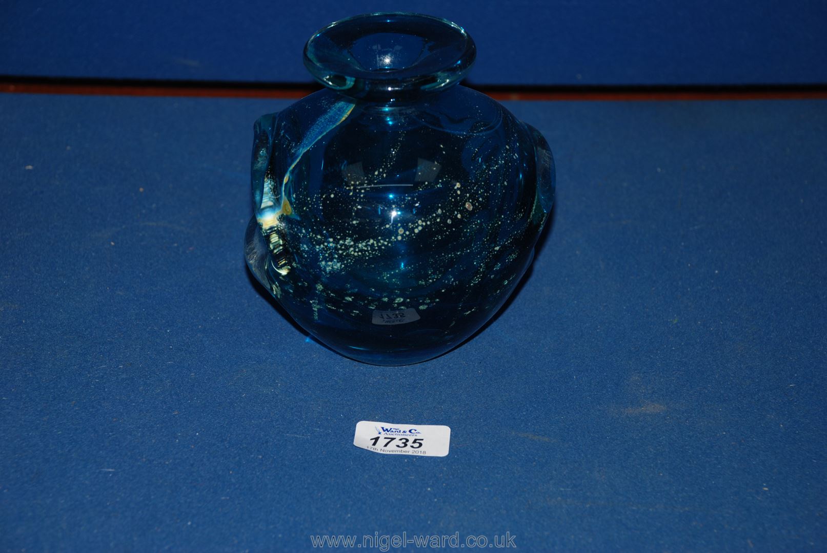 A Mdina eared glass Vase, in a blue mottled design,